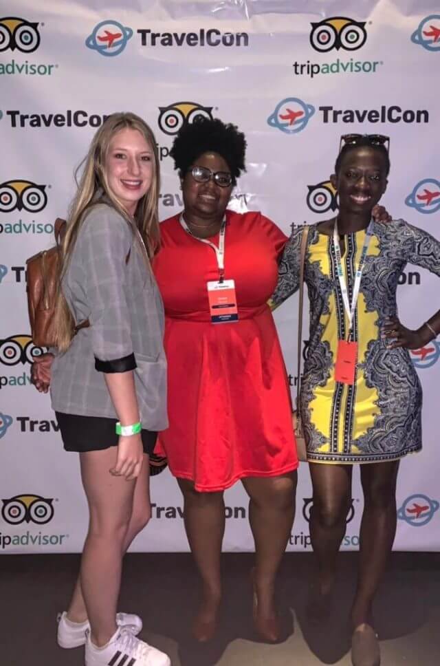 Three travel bloggers from TravelCon pose for a photo after a meetup session.
