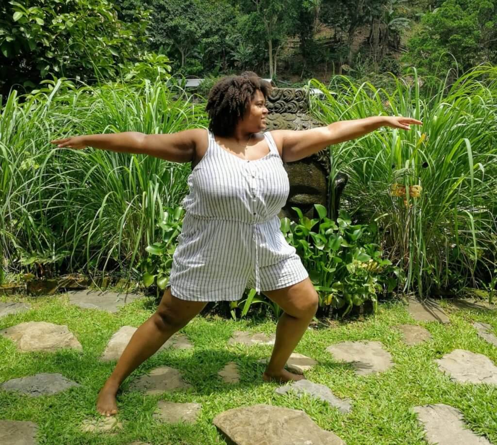 Plus size Black Woman practising Yoga asanas in Nature